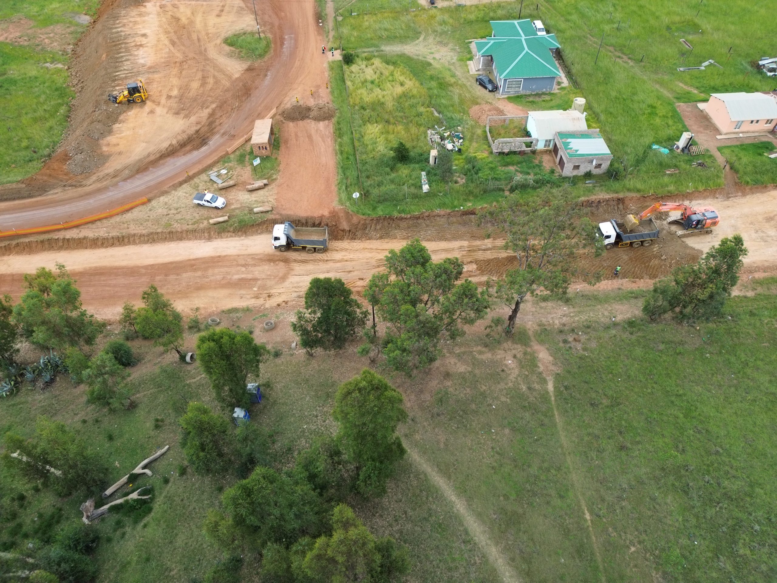 The Sikhululiwe Village access road in its original gravel condition, before any upgrades.